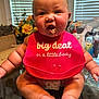 arms, baby, bib, child, chubby, curious, cute, dining_room, expression, face, feet, flowers, food, glass_table, indoor, legs, messy, mouth, table, window_blinds