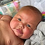 Mollie joined the competition — help win amazing prizes! baby, child, face, skin, blanket, soft, portrait, infant, closeup, cute, smile, eyes, hand, expression, newborn, comfort, warmth, resting, indoors, relaxation