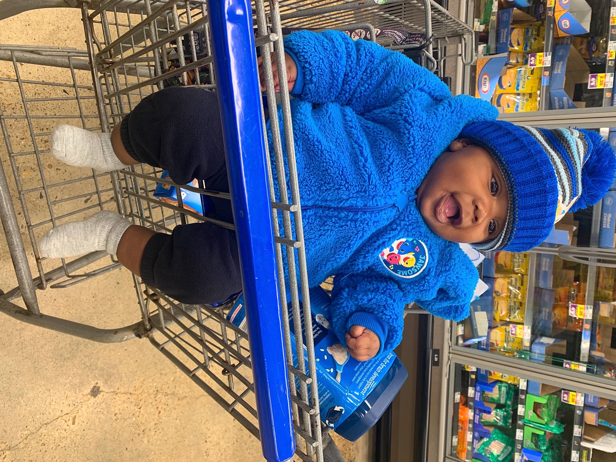 Daveon is registered to the contest to win money with this photo: baby, baby_toddler_clothing, baseball_cap, blue, cap, child, city, electric_blue, engineering, fun, hat, headwear, leisure, machine, metal, person, recreation, shelf, sleeve, smile