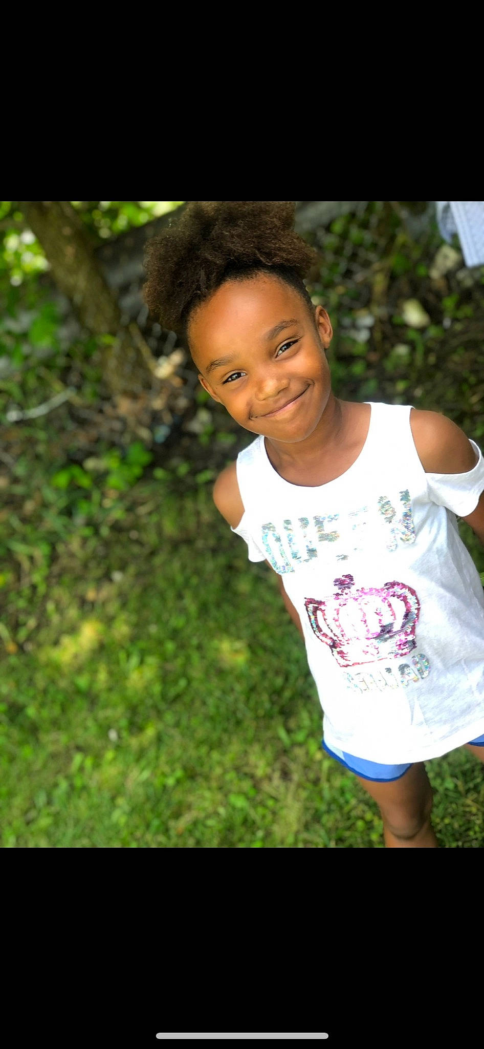 Raleigh is registered to the contest to win money with this photo: black_hair, child, cool, face, flash_photography, fun, grass, hair, happy, head, joy, leaf, leisure, people_in_nature, person, plant, skin, sleeve, smile, t_shirt