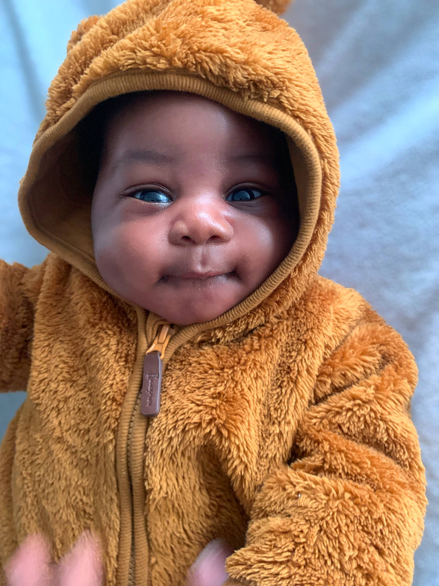 Isaiah participe au concours pour gagner de l'argent avec cette photo : cap, cheek, child, clothing, eye, face, facial_expression, fur_clothing, happy, headwear, iris, jacket, lip, neck, nose, person, skin, sleeve, textile, toddler