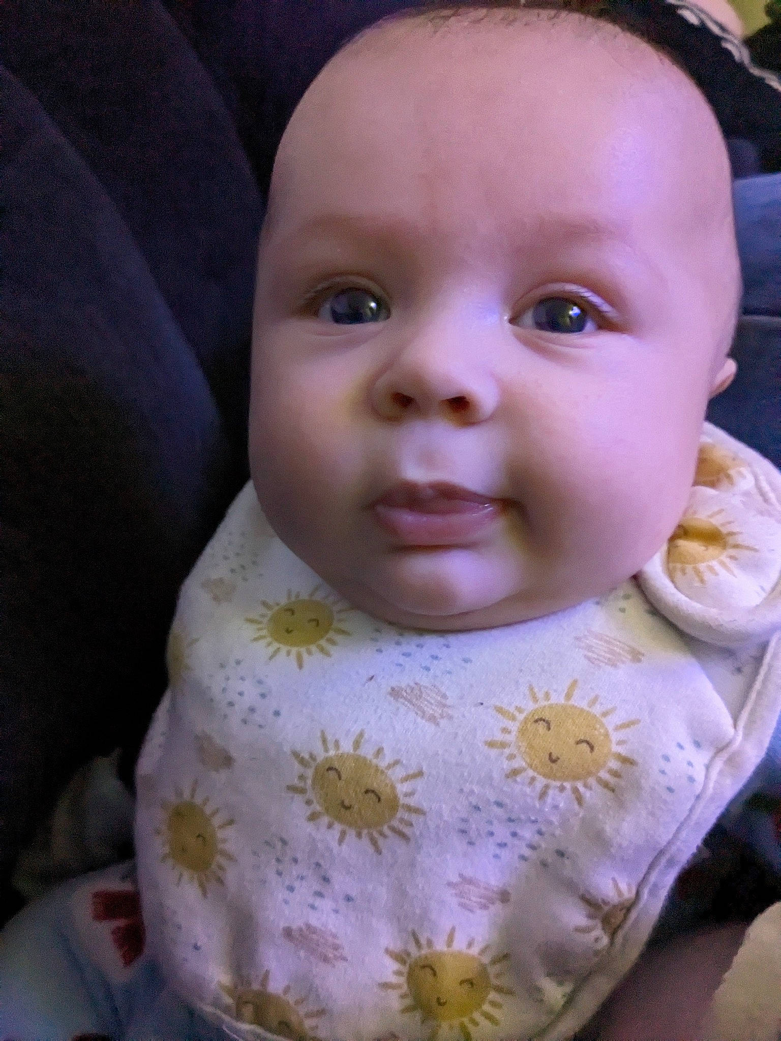 Christos is registered to the contest to win money with this photo: baby, baby_toddler_clothing, bib, cheek, child, chin, eyelash, happy, iris, linens, lip, nose, person, skin, sleeve, smile, toddler