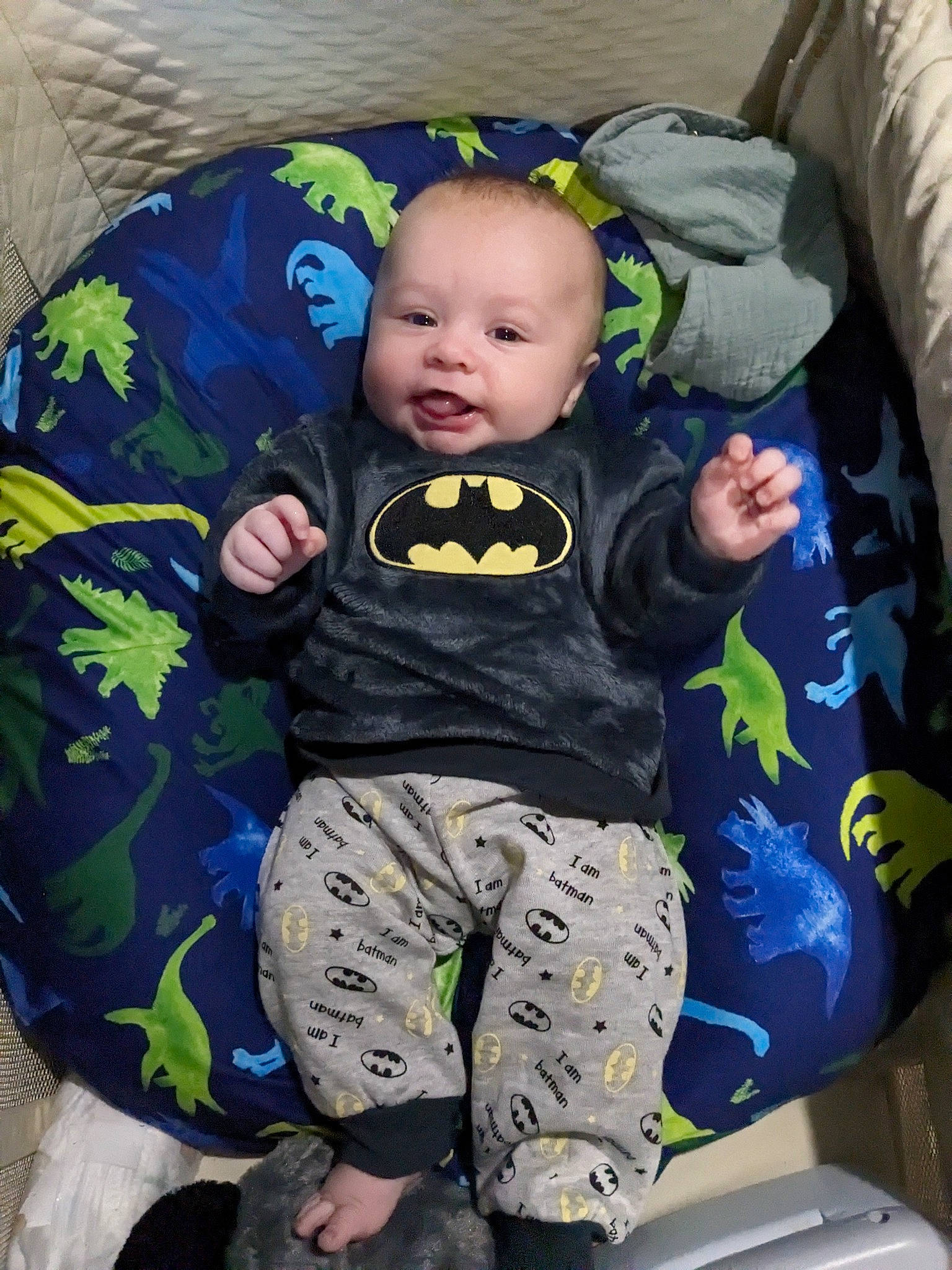 Christos is registered to the contest to win money with this photo: baby, baby_products, baby_toddler_clothing, camouflage, child, comfort, eye, fun, grass, head, leg, linens, military_camouflage, pattern, person, sitting, sleeve, smile, t_shirt, toddler