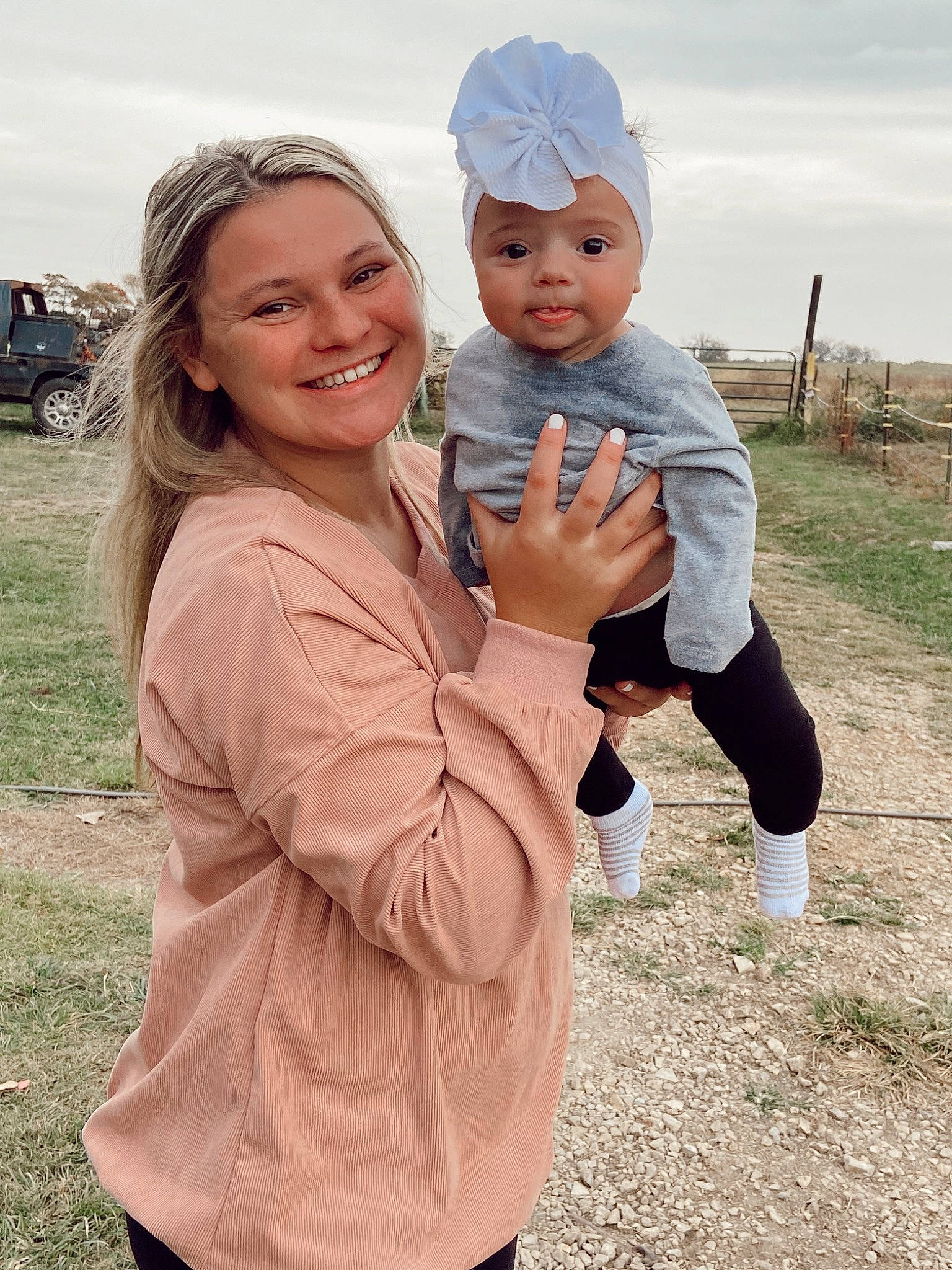 Laramee is registered to the contest to win money with this photo: baby, cap, child, cloud, event, face, fun, gesture, grass, happy, hat, headwear, joy, leisure, people_in_nature, person, recreation, sky, smile, standing