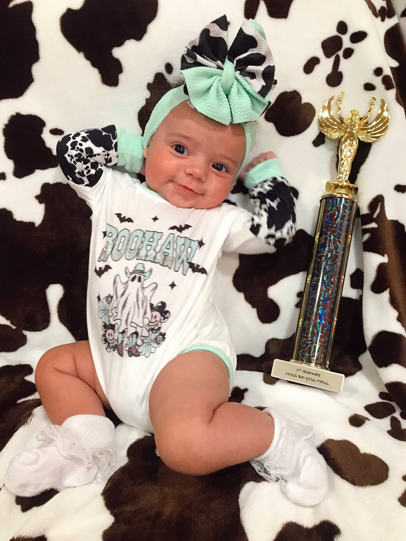 Laramee is registered to the contest to win money with this photo: baby, baby_toddler_clothing, cap, child, cool, costume_hat, design, event, fawn, font, fun, guitar_accessory, happy, headwear, pattern, person, product, sleeve, smile, t_shirt