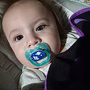 Joshua Jr joined the competition — help win amazing prizes! baby, pacifier, face, blanket, closeup, infant, child, portrait, indoor, cute, sleepwear, comfort, soft, curious, young, head, expression, resting, cozy, childcare