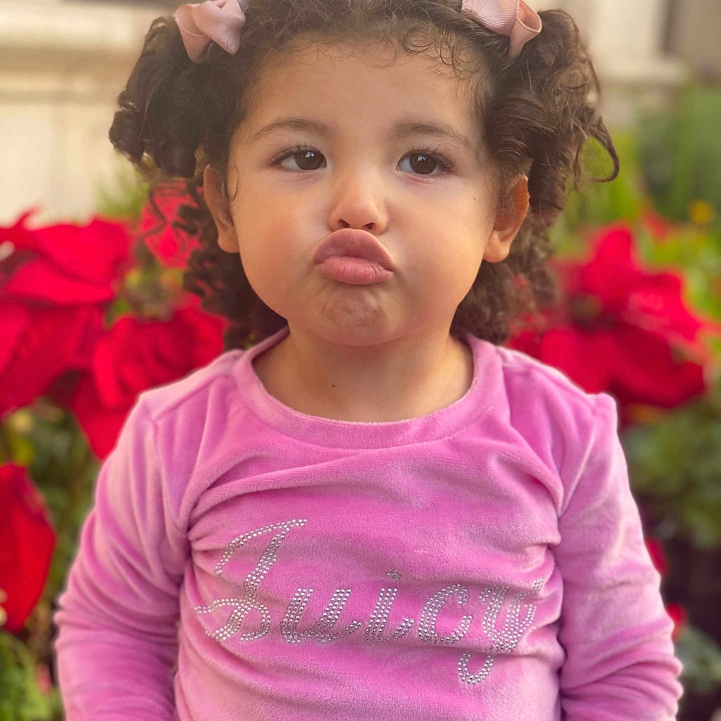 Melody joined the competition — help win amazing prizes! brownhair, child, clothing, curlyhair, face, female, flower, girl, hair, head, longsleeve, person, petal, photography, plant, portrait, pottedplant, purple, sleeve, t_shirt