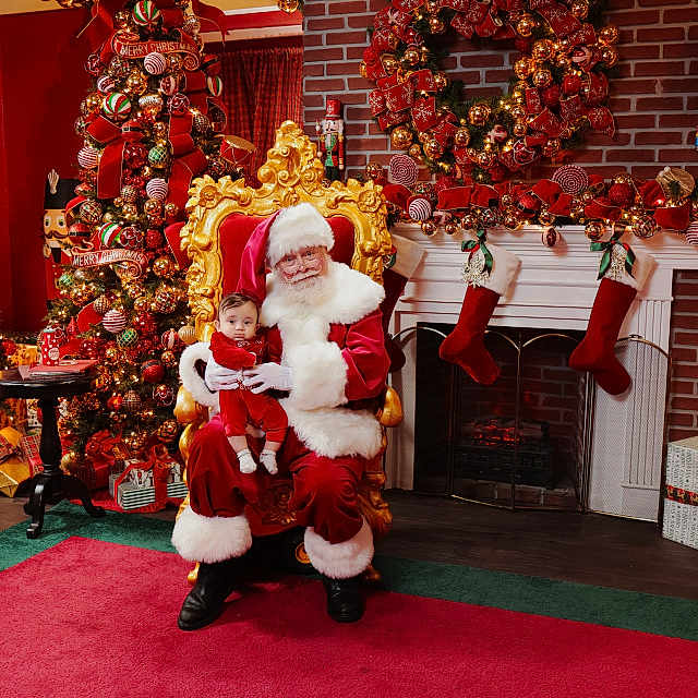 David is registered to the contest to win money with this photo: baby, brick_wall, celebration, child, christmas_decorations, christmas_tree, festive, fireplace, gifts, golden_chair, holiday, holiday_spirit, indoor, person, red_carpet, santa_claus, smiling, stockings, winter, wreath