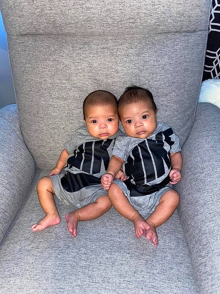 Lyon joined the competition — help win amazing prizes! baby, baby_toddler_clothing, chair, child, comfort, couch, flooring, foot, fun, hairstyle, head, human_leg, lap, leg, pattern, person, sitting, sleeve, sock, toddler