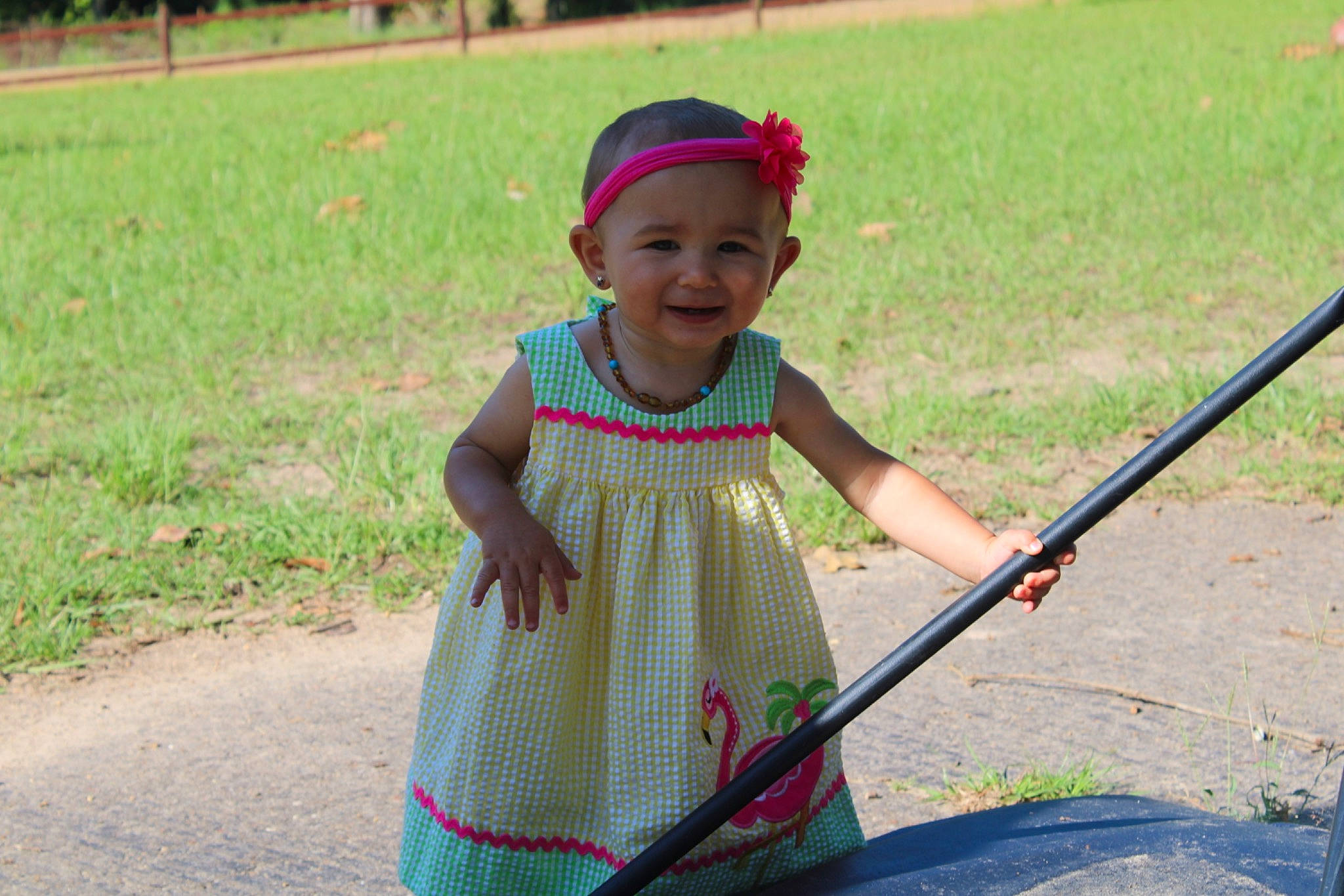 Kasidy is registered to the contest to win money with this photo: adaptation, child, fun, grass, headwear, joy, person, play, recreation, smile, toddler, vacation