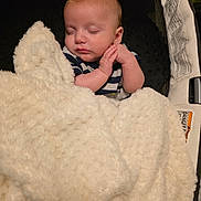 Remington joined the competition — help win amazing prizes! baby, sleeping, blanket, infant, cushion, carrier, clothing, hands, face, peaceful, rest, soft, comfort, indoor, newborn, cute, toddler, child, portrait, nap