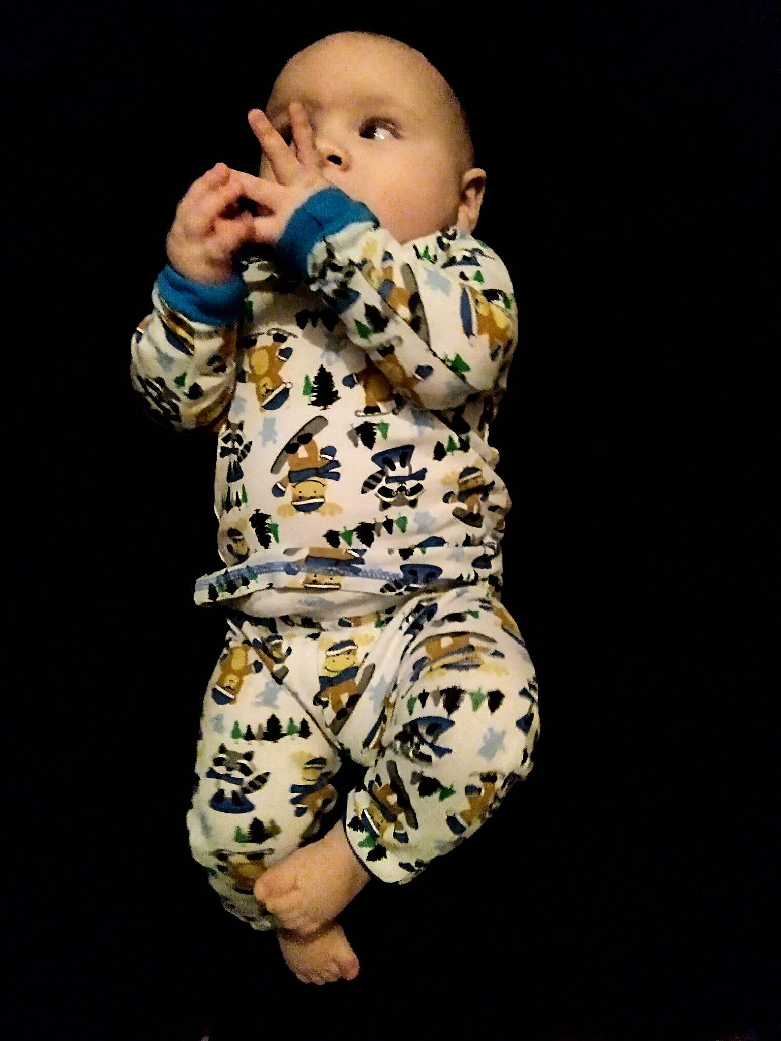 Armani is registered to the contest to win money with this photo: baby, baby_toddler_clothing, camouflage, child, entertainment, fashion_design, fun, gesture, happy, human_leg, military_camouflage, pattern, performing_arts, person, sitting, sleeve, sportswear, thigh, thumb, toddler