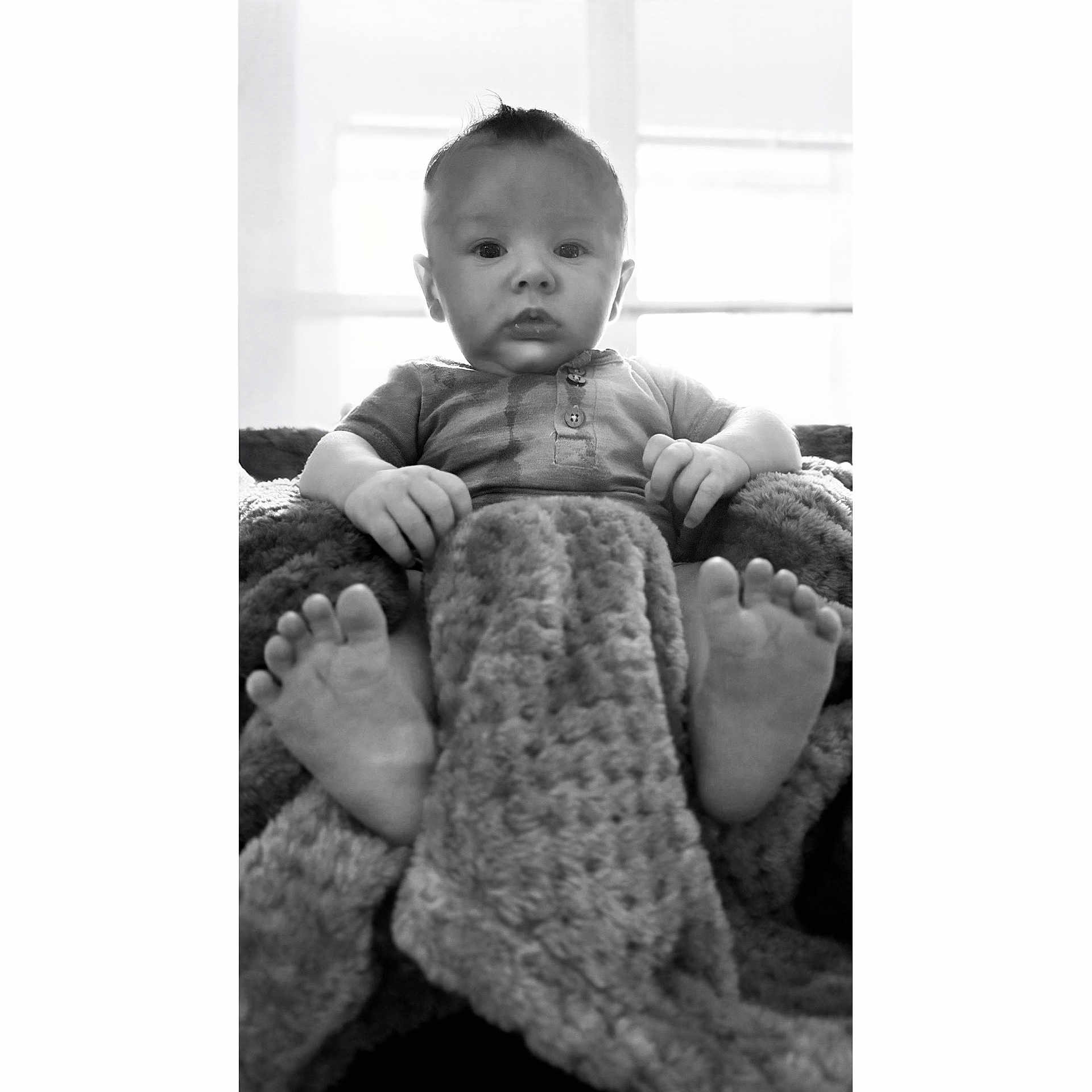 Kailyr is registered to the contest to win money with this photo: baby, barefoot, blanket, bodypart, clothing, couch, face, finger, furniture, hand, head, knitwear, newborn, person, photography, portrait, quilt, sitting, toe, towel