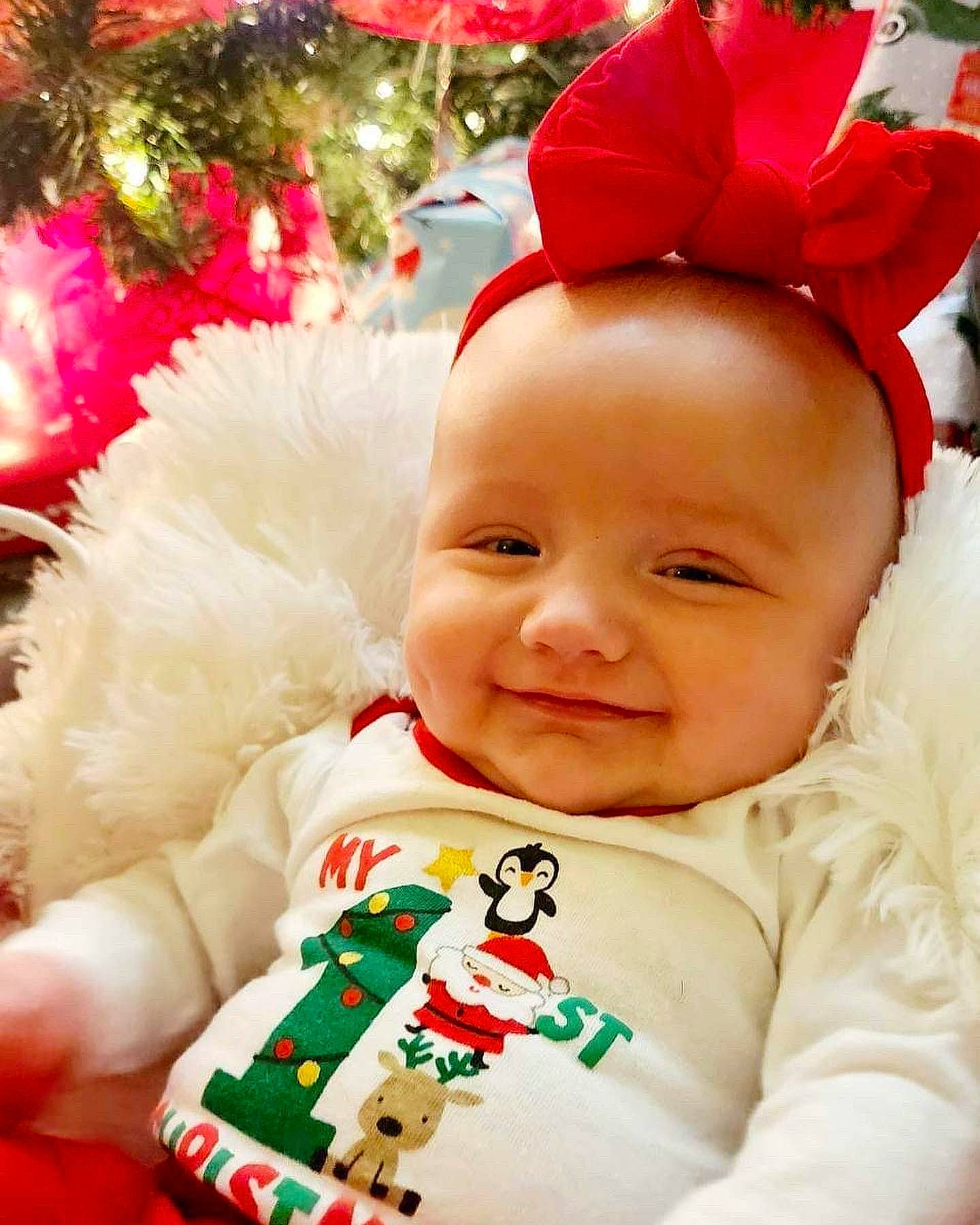 Hayden joined the competition — help win amazing prizes! baby, baby_toddler_clothing, child, christmas, christmas_eve, christmas_tree, costume_hat, event, facial_expression, green, happy, head, holiday, joy, outerwear, person, red, skin, sleeve, smile