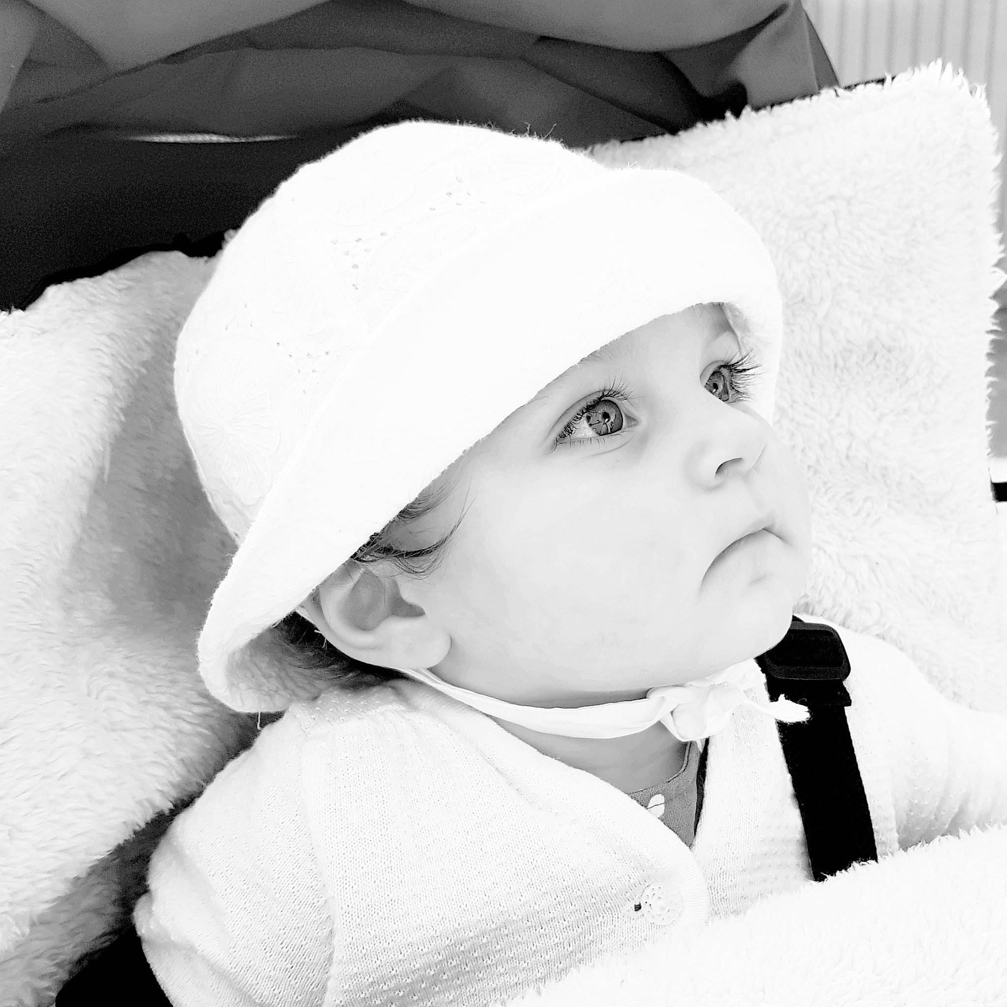 Abbie participe au concours pour gagner de l'argent avec cette photo : baby, cap, cheek, chin, comfort, eyebrow, eyelash, face, flash_photography, happy, headgear, headwear, iris, lip, mouth, nose, outerwear, person, skin, sleeve