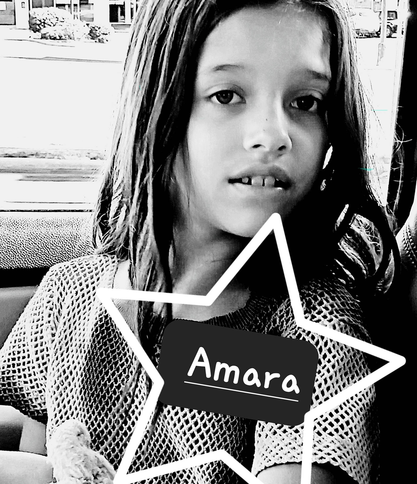 Amara is registered to the contest to win money with this photo: black, black_and_white, eyelash, facial_expression, flash_photography, font, hairstyle, happy, lip, monochrome, monochrome_photography, organ, person, photograph, portrait_photography, sitting, snapshot, street, style, t_shirt