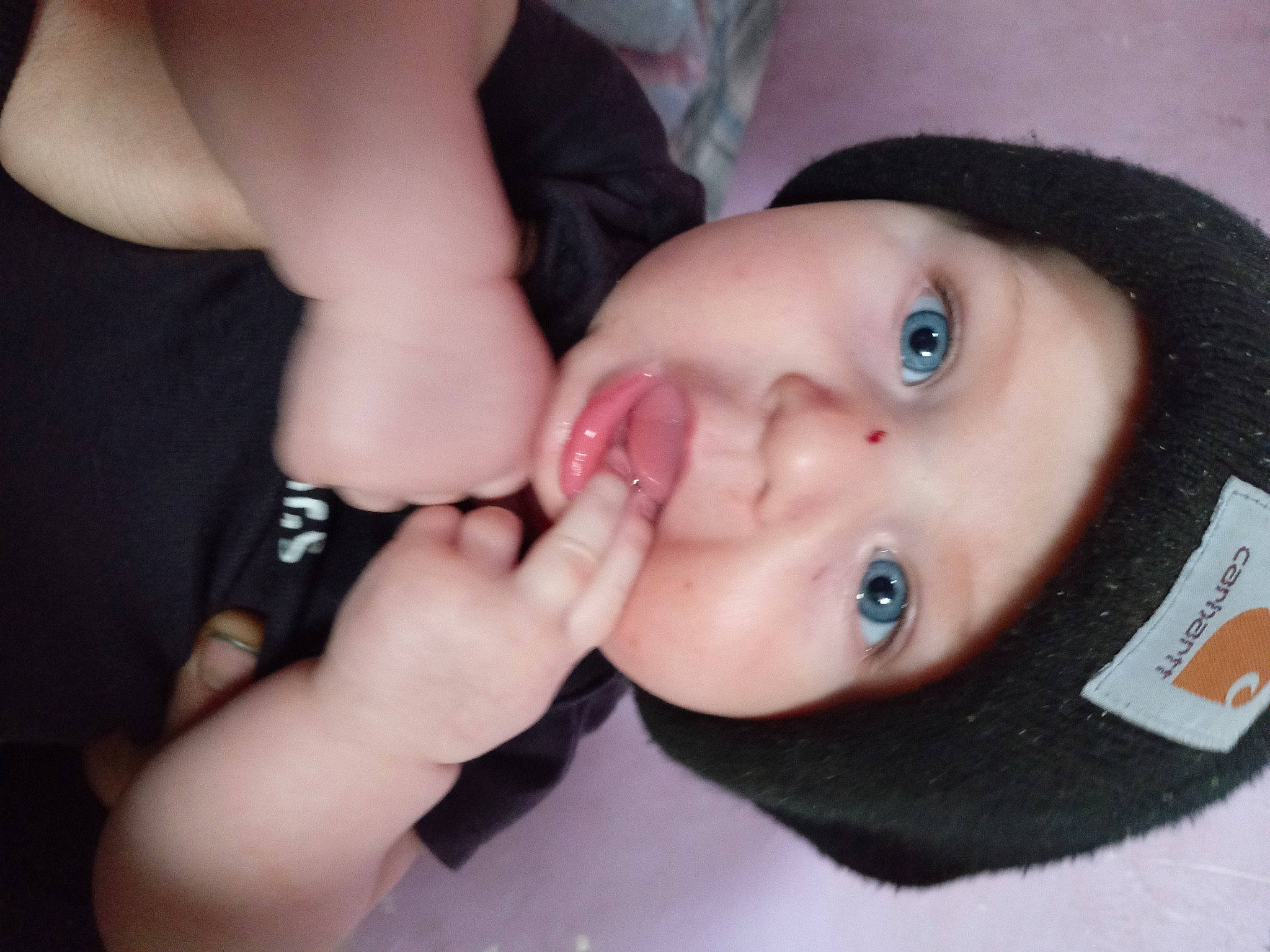 Kolby is registered to the contest to win money with this photo: baby, black_hair, cheek, chin, ear, eyebrow, eyelash, finger, flash_photography, forehead, gesture, headwear, human_body, iris, jaw, lip, mouth, neck, nose, person