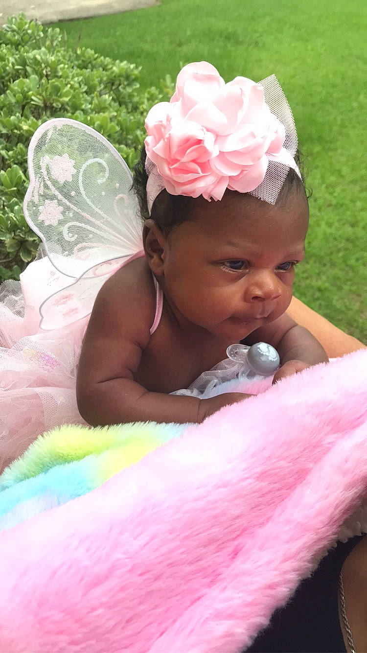 Tiari joined the competition — help win amazing prizes! baby, baby_toddler_clothing, event, flower, fun, grass, hairstyle, happy, headband, headpiece, leisure, magenta, people_in_nature, person, petal, pink, plant, skin, summer, sun_hat