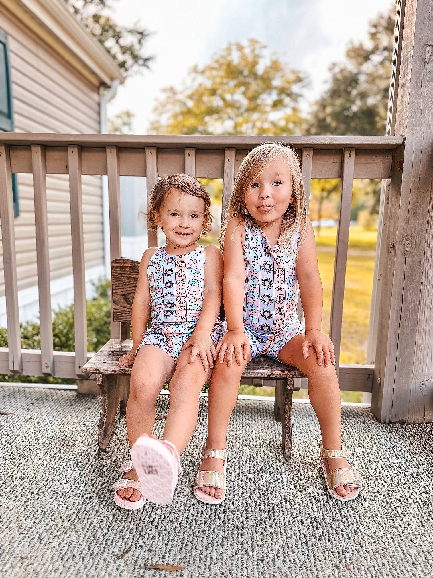 Kinley is registered to the contest to win money with this photo: blond, fawn, foot, footwear, grass, hair, happy, human_leg, joy, knee, leg, leisure, pattern, person, plant, sandal, shoe, sky, sneakers, thigh