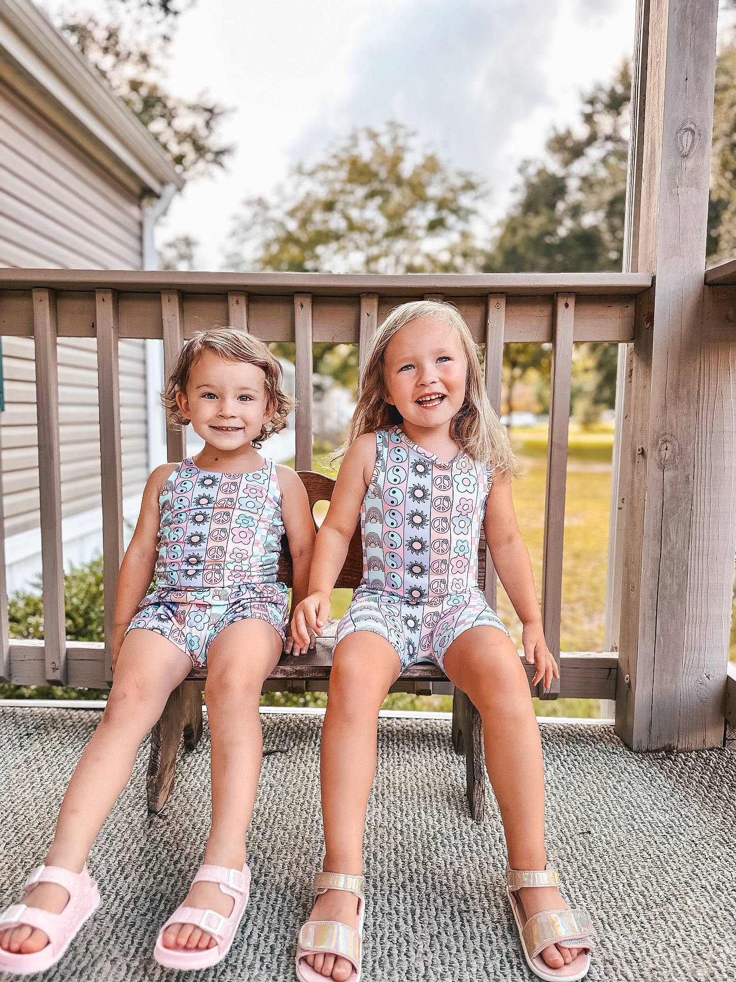 Kinley joined the competition — help win amazing prizes! cloud, event, foot, fun, grass, happy, human_leg, joy, leisure, pattern, people_in_nature, person, plant, recreation, sandal, sitting, sky, smile, summer, thigh