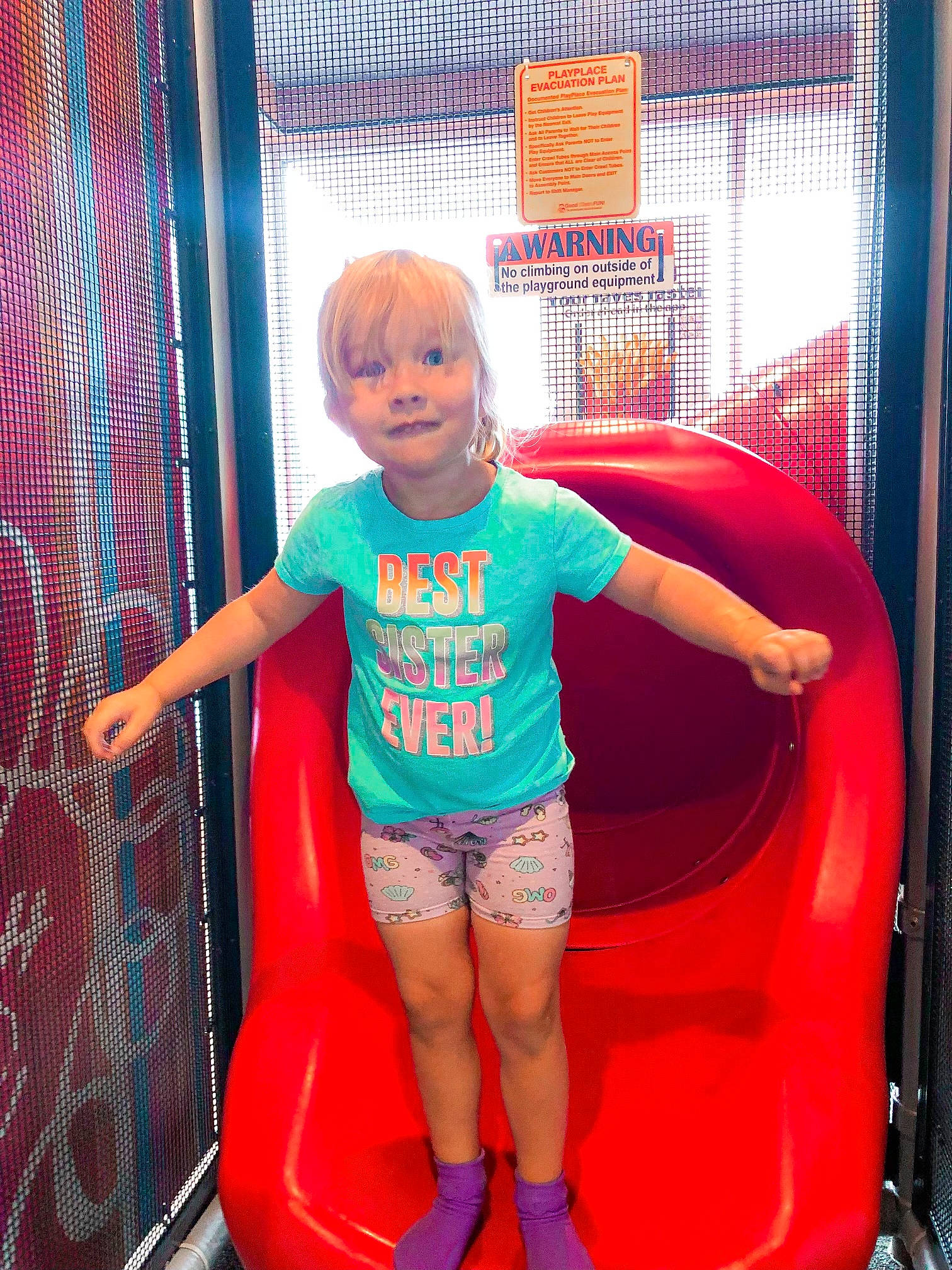 Kinley is registered to the contest to win money with this photo: baby_toddler_clothing, child, city, electric_blue, fun, hairstyle, happy, human_leg, joy, leisure, magenta, outdoor_play_equipment, person, pink, play, recreation, red, shorts, smile, t_shirt
