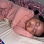 Adanna joined the competition — help win amazing prizes! baby, sleeping, infant, pink_clothing, bed, pillow, pacifier, curled_up, cozy, indoors, child, peaceful, resting, soft_fabric, zebra_pattern, cute, young_child, face, head, blanket