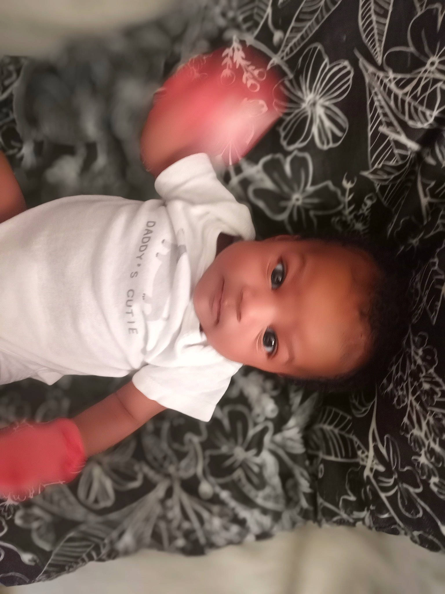 Ca'Miyah is registered to the contest to win money with this photo: arm, baby, baby_toddler_clothing, cheek, child, eye, eyelash, face, fashion_accessory, grass, hat, head, headgear, human_body, lip, pattern, person, skin, sleeve, toddler