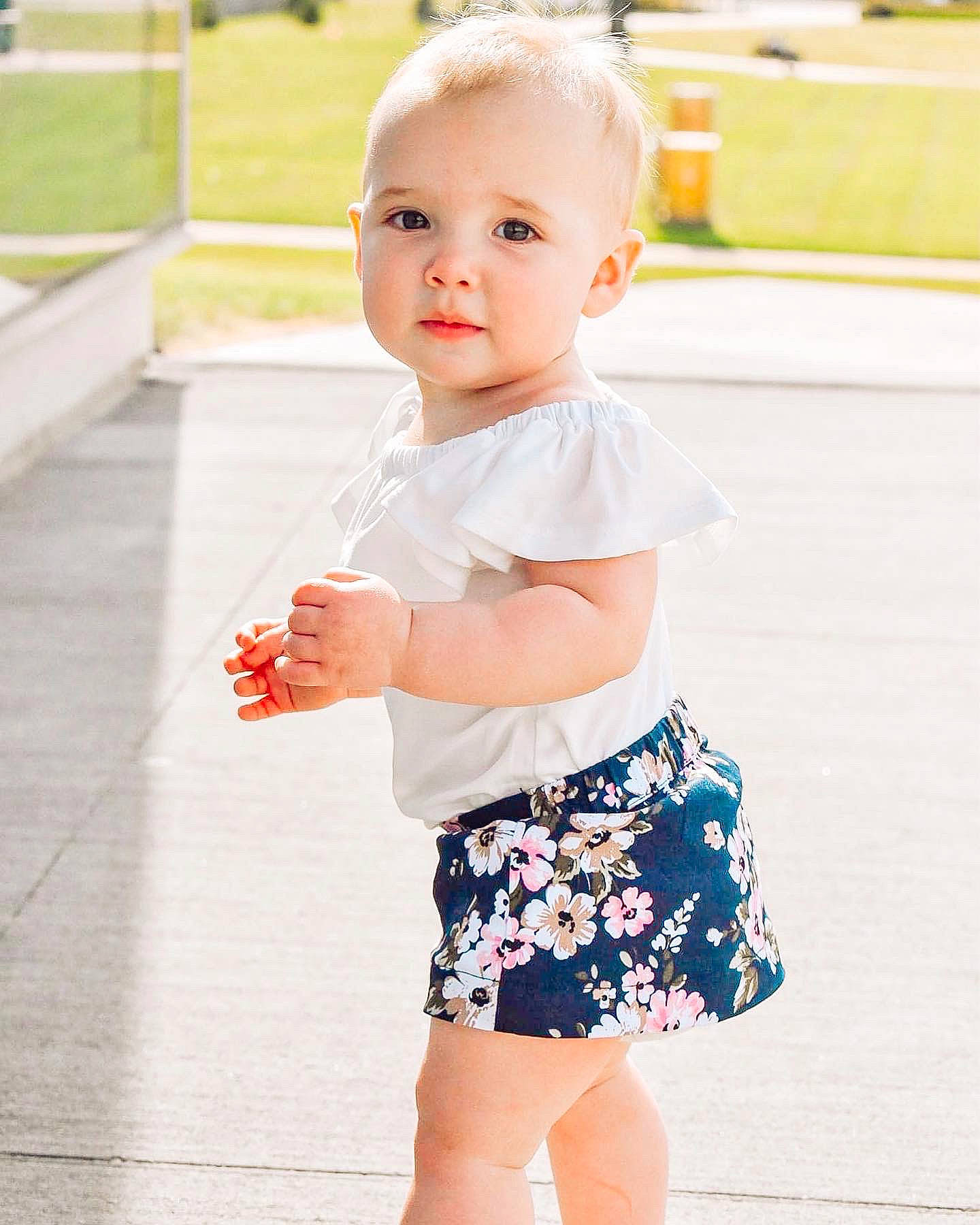 Oaklee joined the competition — help win amazing prizes! baby_toddler_clothing, day_dress, facial_expression, happy, joint, knee, neck, person, photograph, pink, shoulder, skin, sleeve, street_fashion, summer, t_shirt, thigh, toddler, trunk, waist
