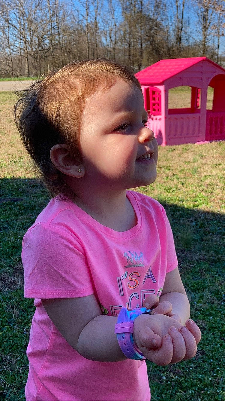 Braelyn is registered to the contest to win money with this photo: baby_toddler_clothing, gesture, grass, happy, iris, leisure, lip, magenta, mouth, nose, person, pink, plant, recreation, skin, sky, smile, summer, thumb, toddler