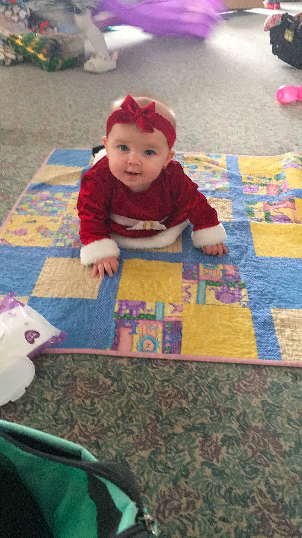 Braelyn joined the competition — help win amazing prizes! art, baby, baby_toddler_clothing, carmine, carpet, child, floor, flooring, fun, grass, headwear, linens, pattern, person, playmat, red, room, textile, toddler, toy