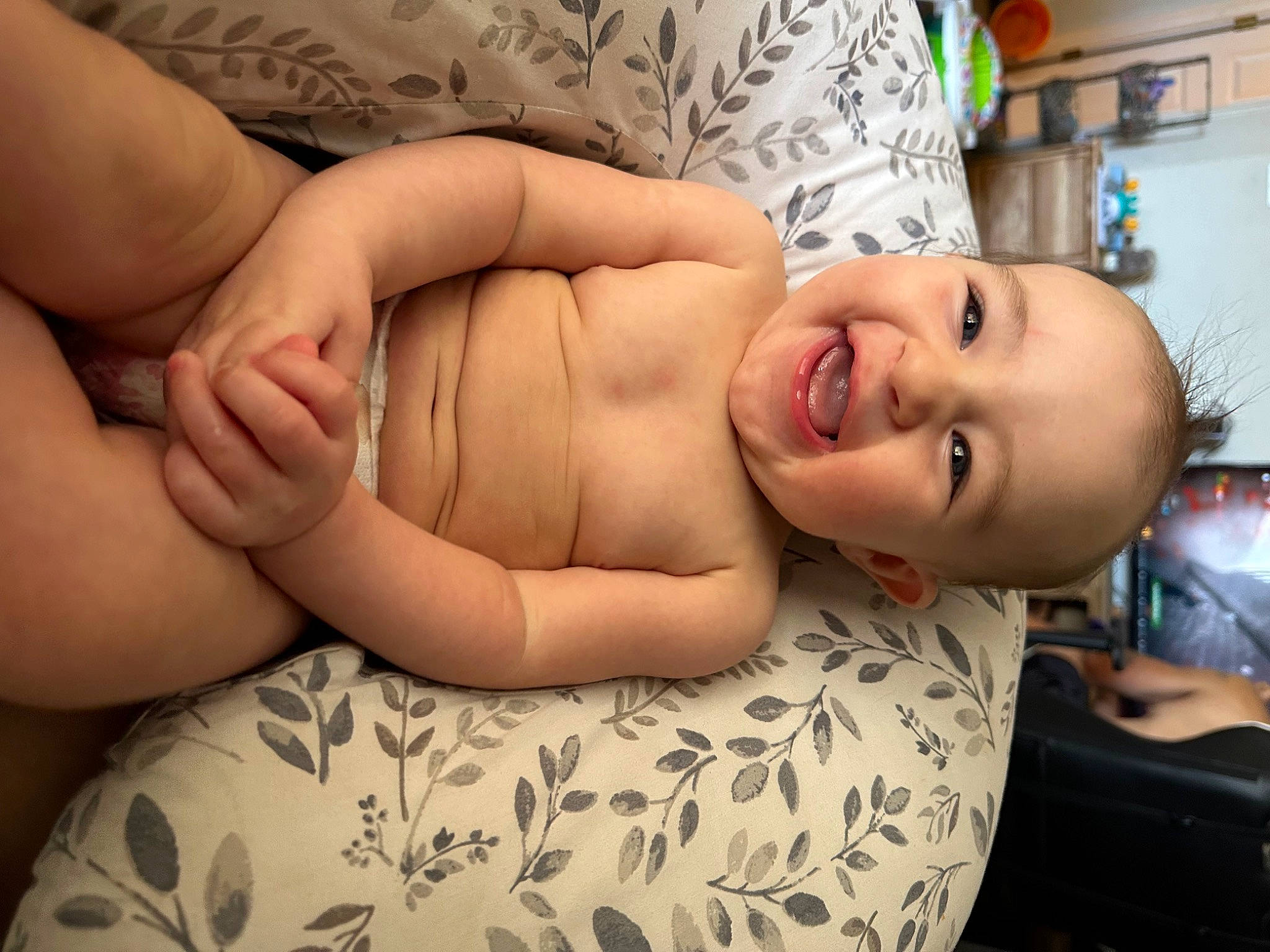 Charlotte is registered to the contest to win money with this photo: abdomen, chest, child, comfort, couch, elbow, finger, glasses, hand, happy, human_leg, knee, leg, muscle, person, skin, smile, stomach, thigh, toddler