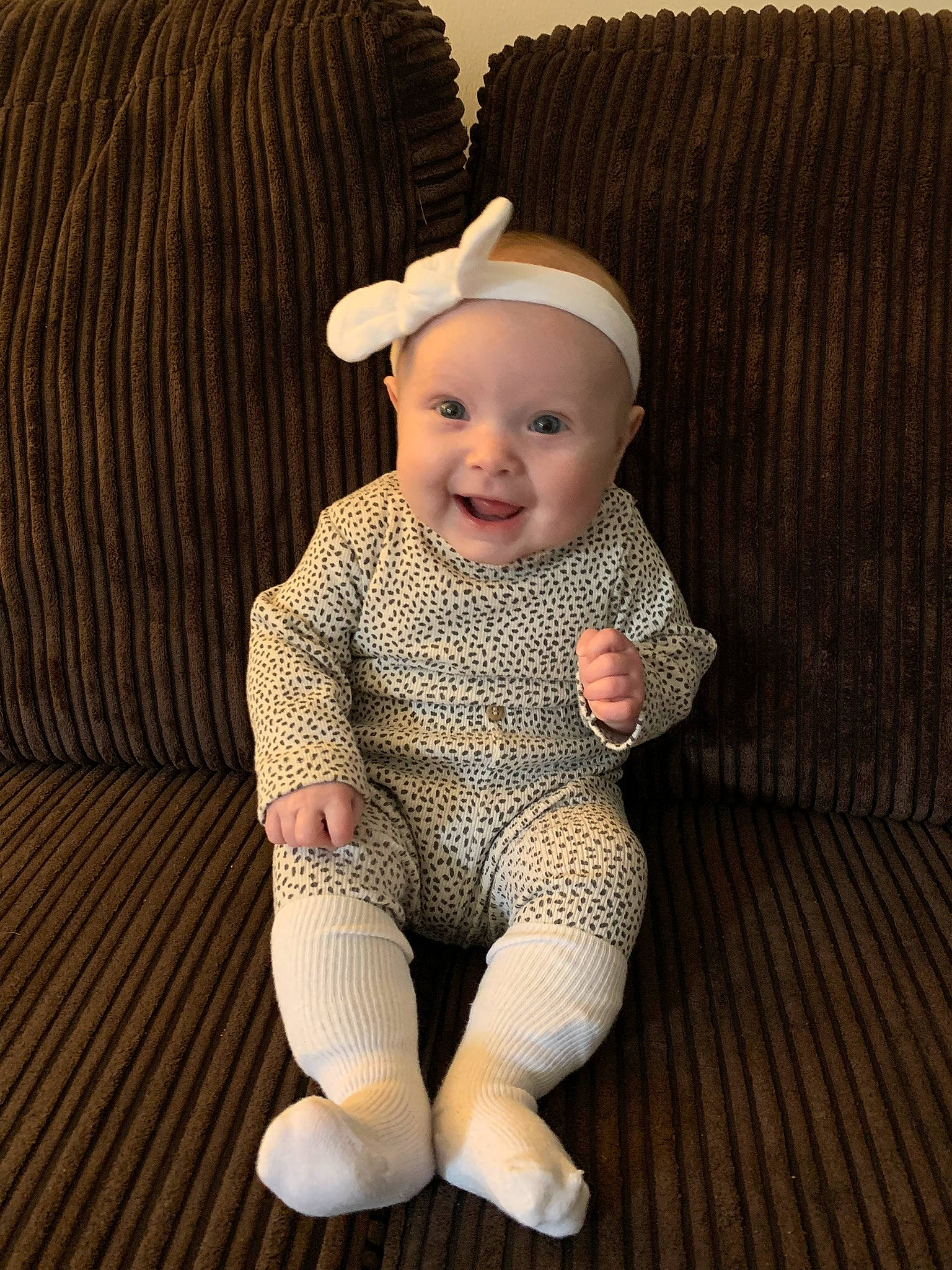 Lillie-mae is registered to the contest to win money with this photo: baby, baby_products, baby_toddler_clothing, eye, face, flooring, happy, head, headgear, headwear, human_body, human_leg, iris, joy, knee, lip, pattern, person, sleeve, smile