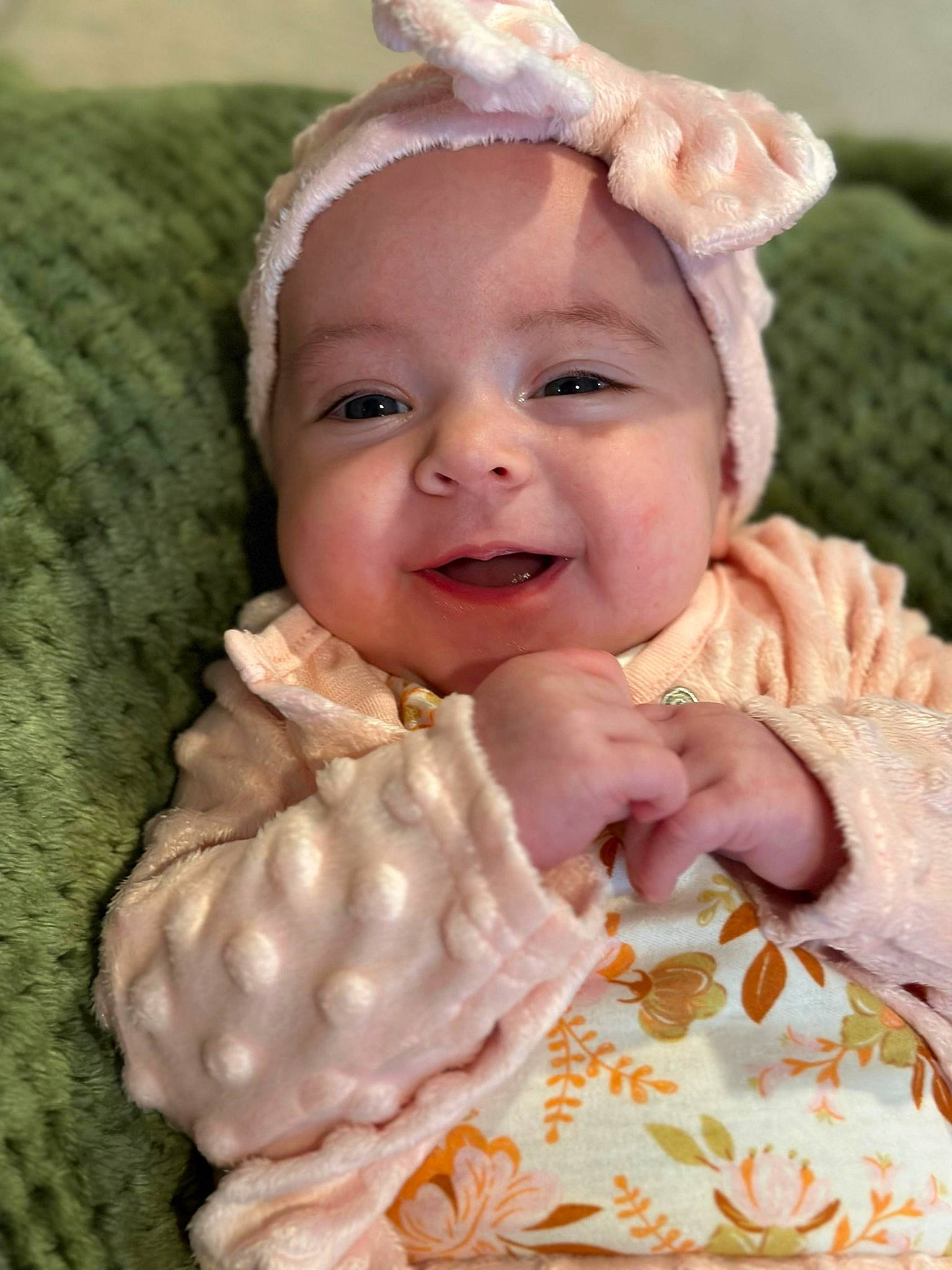 Ella joined the competition — help win amazing prizes! baby, baby_products, baby_toddler_clothing, cheek, child, fashion_accessory, gesture, grass, happy, headband, headwear, linens, lip, nose, peach, person, pink, skin, smile, sweetness