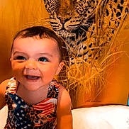 Ashanti joined the competition — help win amazing prizes! animal, baby, bodypart, cheetah, couch, face, finger, furniture, hand, happy, head, laughing, mouth, panther, person, photography, portrait, sitting, smile, teeth