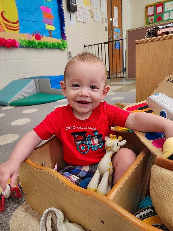 Jakobi joined the competition — help win amazing prizes! baby, baby_toddler_clothing, child, event, fun, grass, happy, joy, leisure, people, person, recreation, shorts, sitting, smile, snapshot, summer, t_shirt, toddler, vacation