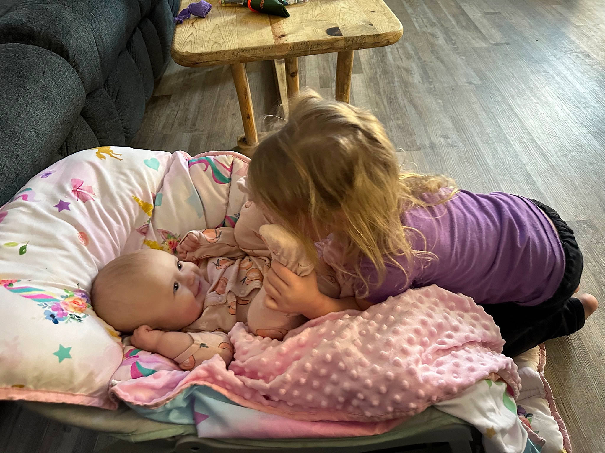 Georgia joined the competition — help win amazing prizes! baby, baby_products, baby_toddler_clothing, bedtime, child, comfort, flooring, human_leg, lap, nap, person, room, sitting, sleep, toddler, wood