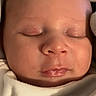 Donnie is registered to the contest to win money with this photo: baby, close_up, sleeping, face, infant, skin, blanket, cozy, peaceful, newborn, soft_lighting, portrait, child, cute, resting, young, indoors, head, peace, warm
