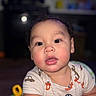 Xylo-King is registered to the contest to win money with this photo: baby, toddler, child, face, curly_hair, onesie, car_pattern, rosy_cheeks, indoor, toy, colorful, closeup, portrait, expression, cute, young_child, person, infant, looking, skin