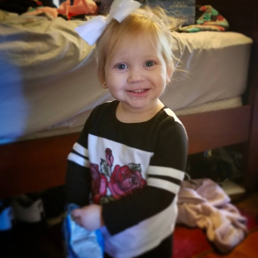 Lily Mae is registered to the contest to win money with this photo: arm, blond, boy, cheek, child, day, eye, facial_expression, girl, hair, head, human_hair_color, infant, joy, organ, person, product, sitting, skin, smile