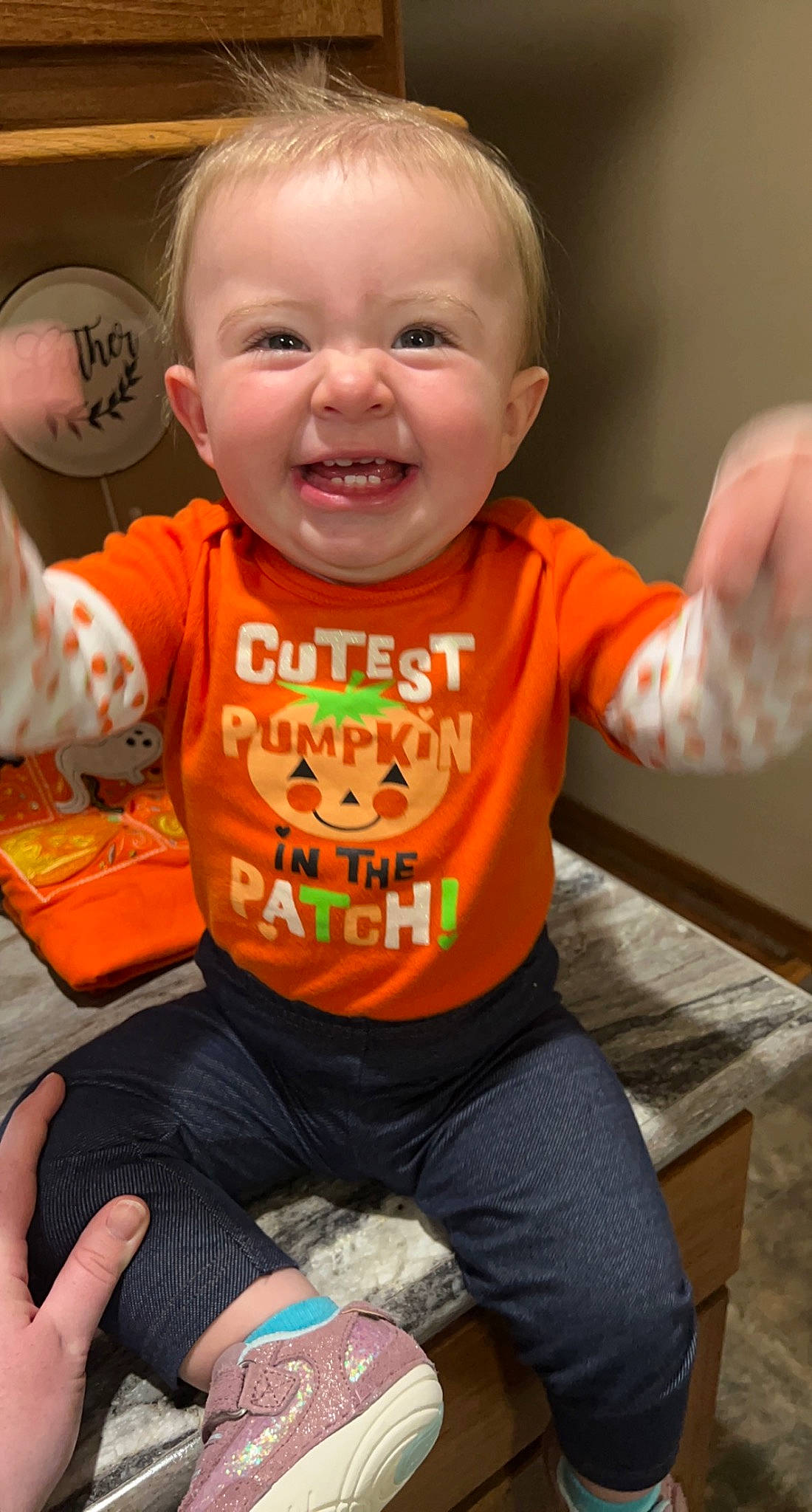 Maci joined the competition — help win amazing prizes! arm, baby, baby_toddler_clothing, cheek, chin, eye, facial_expression, finger, hand, happy, head, leg, nose, orange, person, skin, sleeve, smile, standing, t_shirt