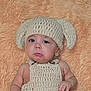 Orion joined the competition — help win amazing prizes! baby, child, crocheted_hat, crocheted_outfit, pouty_face, blue_eyes, soft_blanket, peach_color, infant, cute, portrait, headwear, hand, skin, indoors, cozy, expression, young_child, knitwear, newborn