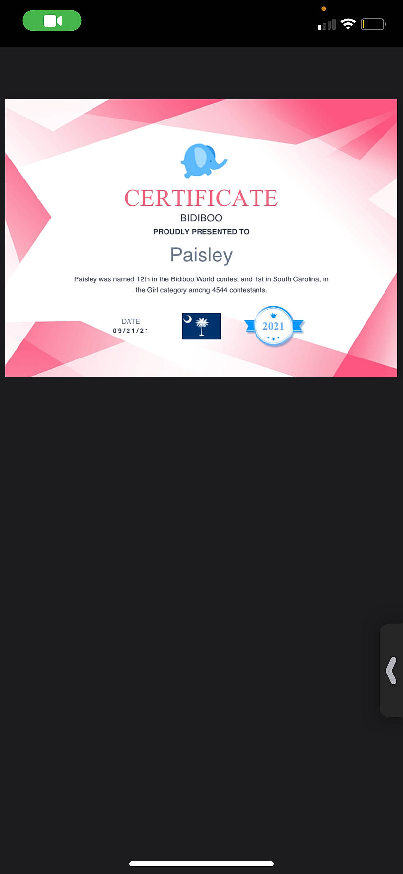 Paisley is registered to the contest to win money with this photo: advertising, brand, circle, communication_device, display_device, electric_blue, event, font, gadget, graphic_design, graphics, logo, magenta, multimedia, rectangle, screenshot, signage, technology