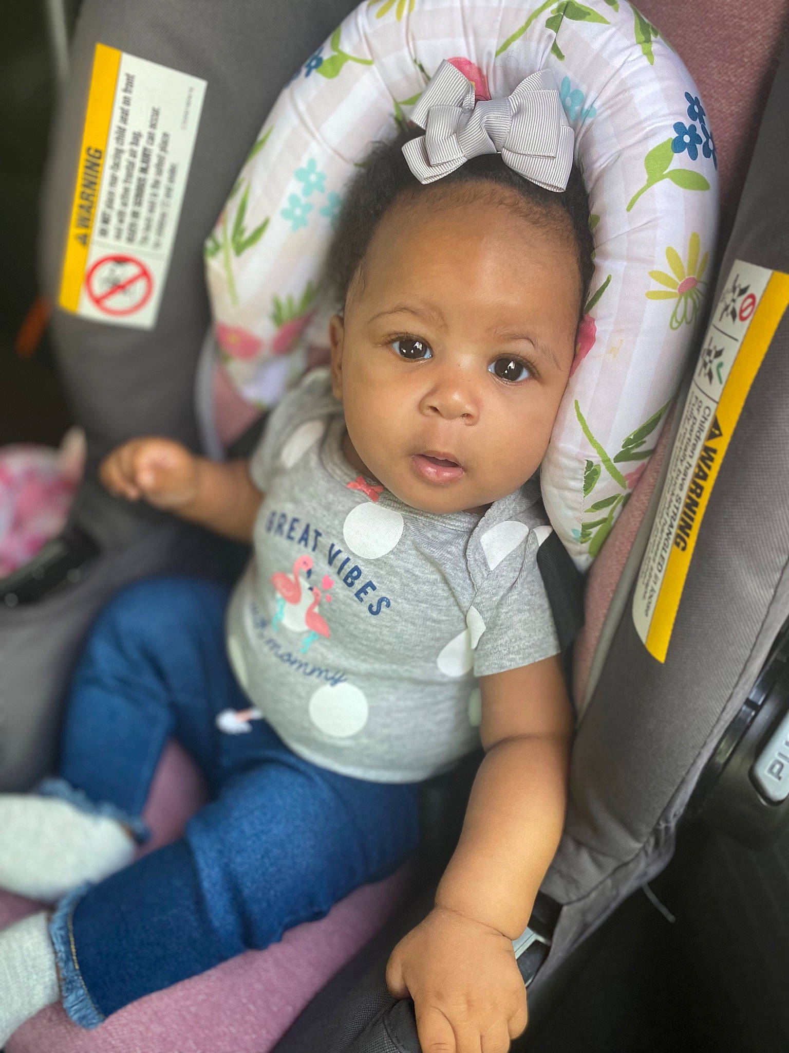 Paisley is registered to the contest to win money with this photo: baby, baby_carriage, baby_in_car_seat, baby_toddler_clothing, car_seat, cheek, child, comfort, eye, finger, fun, happy, iris, jeans, leg, mouth, nose, person, sitting, skin