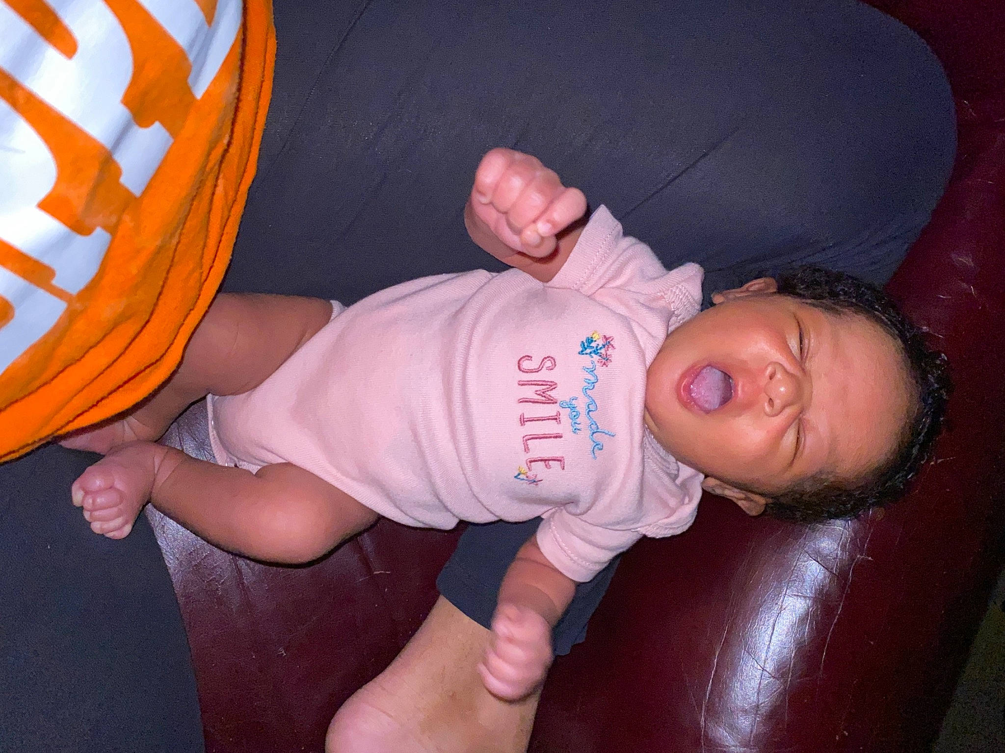 Paisley joined the competition — help win amazing prizes! baby, baby_toddler_clothing, comfort, elbow, finger, fun, gesture, hand, human_body, joint, knee, leg, mouth, muscle, orange, person, skin, t_shirt, thigh, thumb