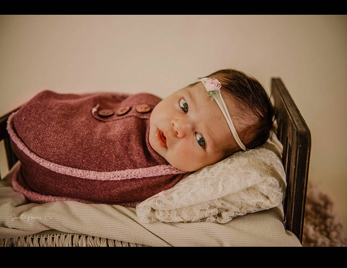 Amiah joined the competition — help win amazing prizes! baby, cheek, child, comfort, couch, eye, flash_photography, fur, happy, iris, linens, lip, nose, person, portrait, portrait_photography, room, sitting, toddler, wood