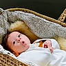 baby, infant, basket, blanket, woven, cozy, expression, face, cute, indoors, soft, child, newborn, lying_down, patterned, hands, head, white_clothing, floor, home