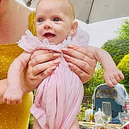 Dorothea joined the competition — help win amazing prizes! baby, child, infant, pink_dress, smiling, happy, outdoor, garden, umbrella, adult_hands, yellow_dress, table, glass, plate, feeding_bottle, high_chair, food, drink, summer, daylight