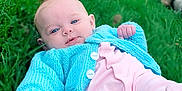 Dorothea joined the competition — help win amazing prizes! baby, blue_sweater, child, cute, eyes, face, footwear, grass, greenery, hand, infant, knitwear, nature, outdoor, person, pet_tail, pink_pants, portrait, relaxing, skin