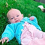 baby, blue_sweater, child, cute, eyes, face, footwear, grass, greenery, hand, infant, knitwear, nature, outdoor, person, pet_tail, pink_pants, portrait, relaxing, skin