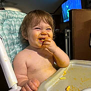 Grayson is registered to the contest to win money with this photo: baby, bodypart, chair, computerhardware, cutlery, eating, electronics, face, finger, food, furniture, hand, hardware, head, monitor, person, photography, portrait, screen, tv